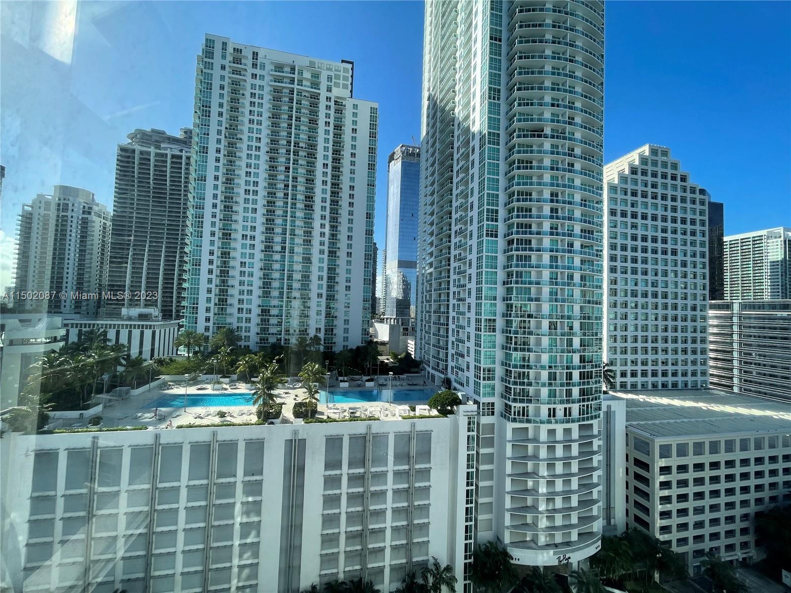 999 Brickell Bay Drive, Unit 1908 Miami, FL 33131 - Photo 54 of 57 a view of a tall building