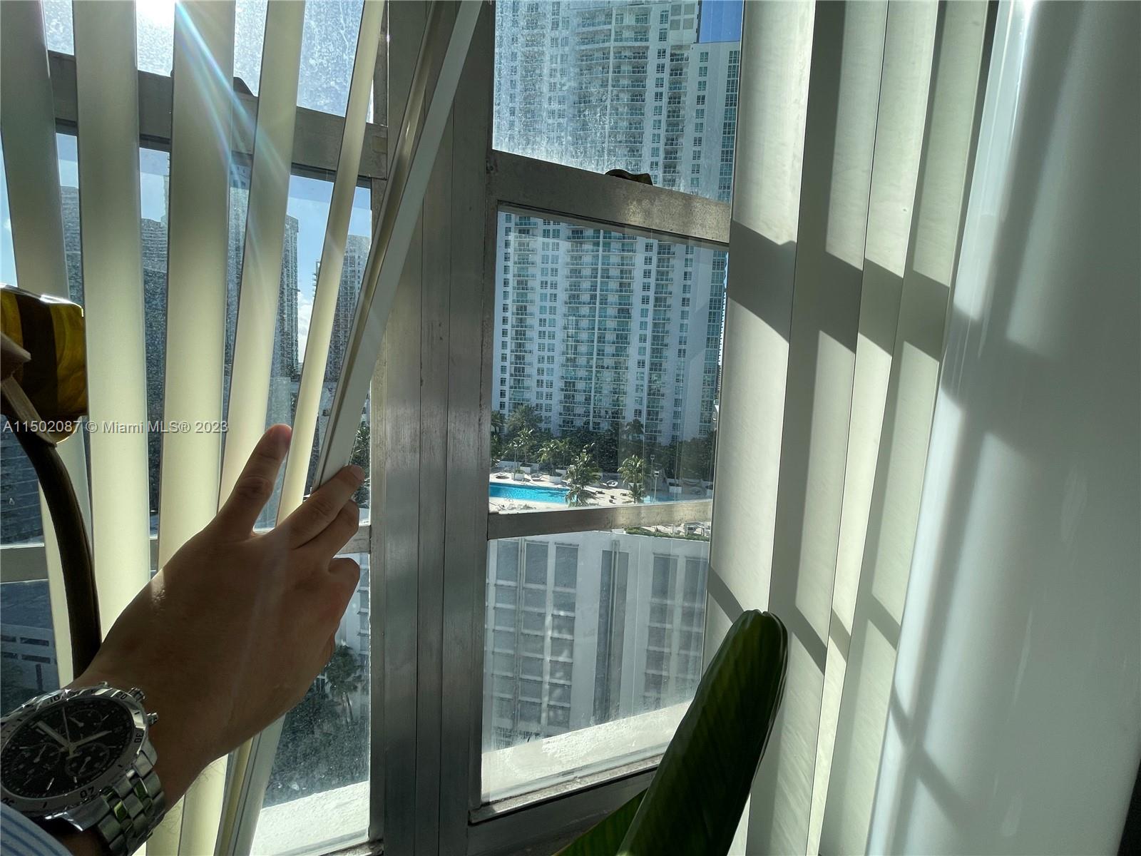 999 Brickell Bay Drive, Unit 1908 Miami, FL 33131 - Photo 55 of 57 a view of balcony and wooden floor