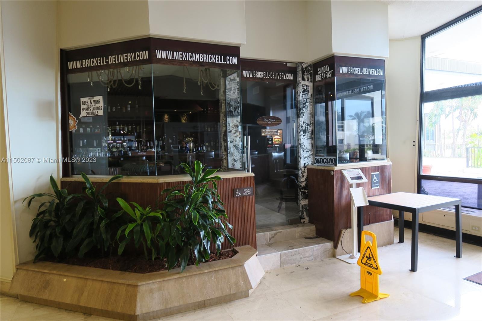 999 Brickell Bay Drive, Unit 1908 Miami, FL 33131 - Photo 10 of 57 a living room with furniture and a potted plant