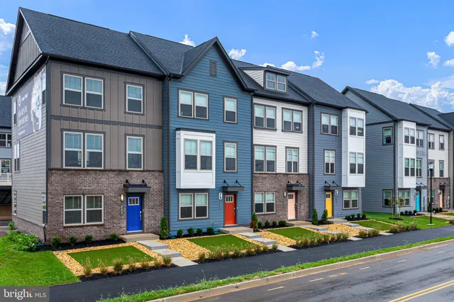 a view of a big house with a yard