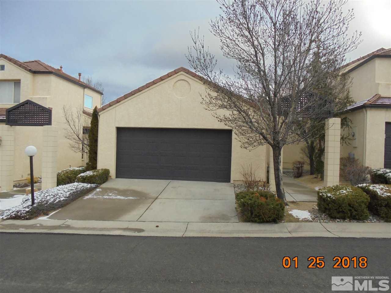 3635 Skyline Boulevard Reno, NV 89509 - Photo 1 of 37 a front view of a house with garage
