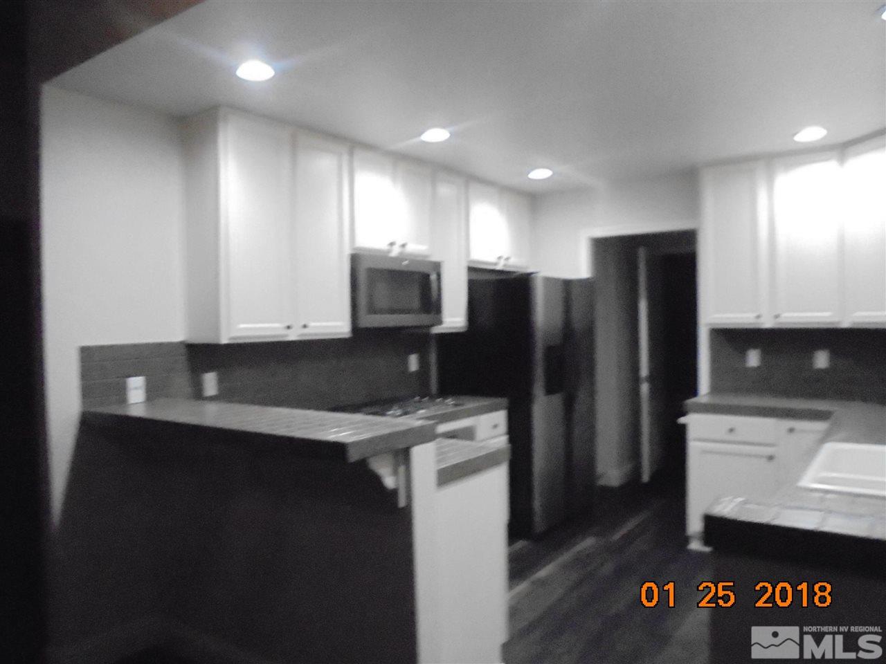 3635 Skyline Boulevard Reno, NV 89509 - Photo 12 of 37 a kitchen with a refrigerator and a sink
