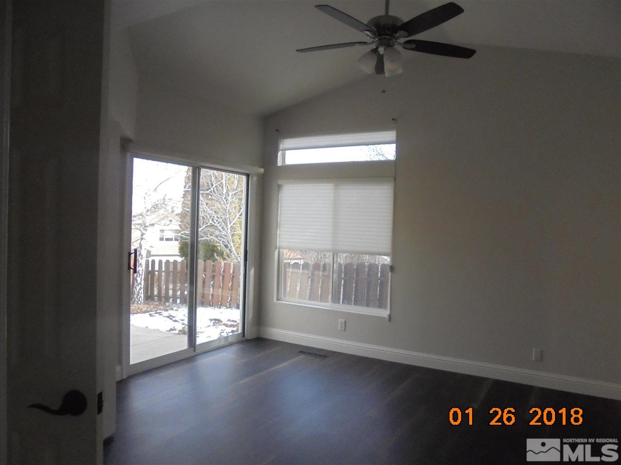 3635 Skyline Boulevard Reno, NV 89509 - Photo 24 of 37 an empty room with wooden floor and windows