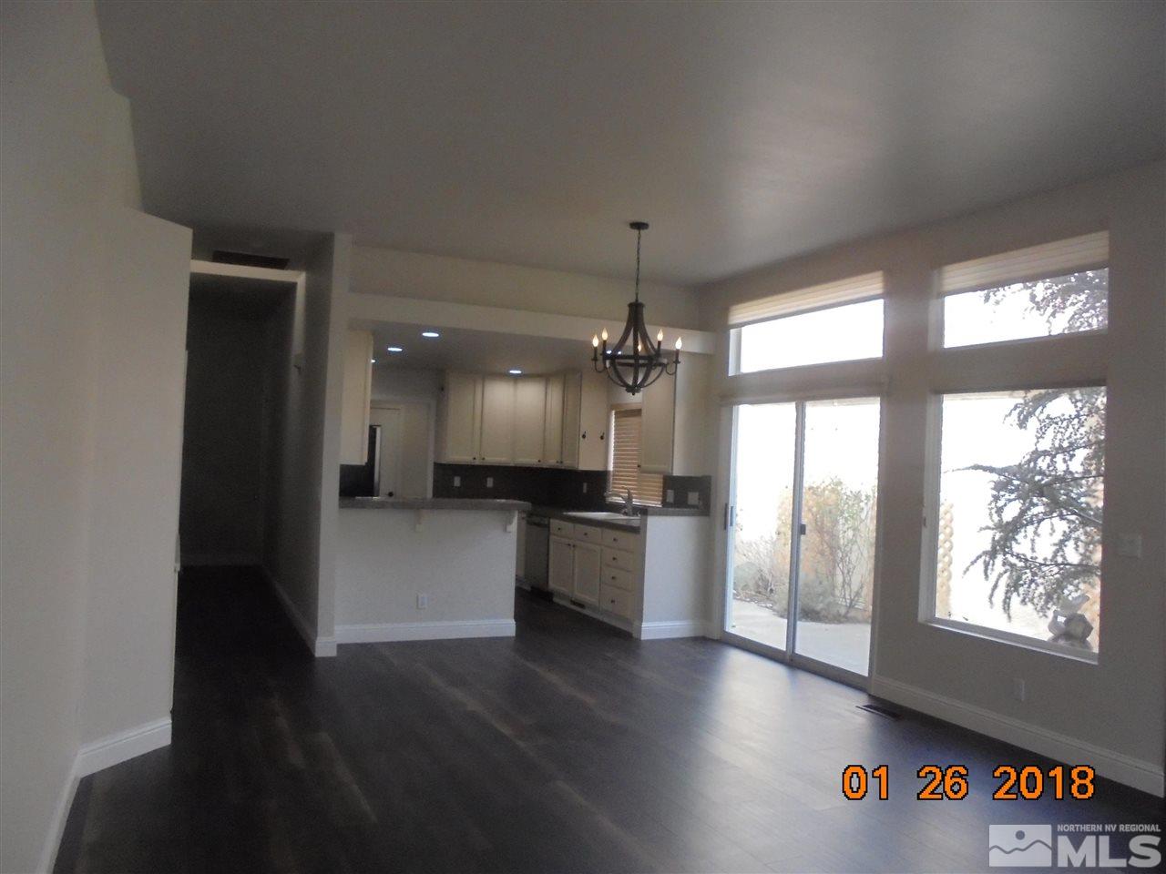 3635 Skyline Boulevard Reno, NV 89509 - Photo 25 of 37 a large white kitchen with a large window