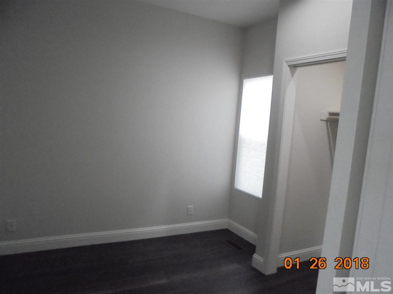 3635 Skyline Boulevard Reno, NV 89509 - Photo 28 of 37 a view of an empty room and wooden floor
