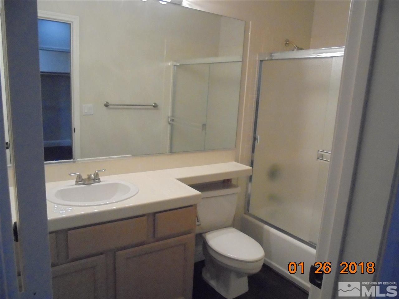 3635 Skyline Boulevard Reno, NV 89509 - Photo 29 of 37 a bathroom with a sink toilet vanity and shower