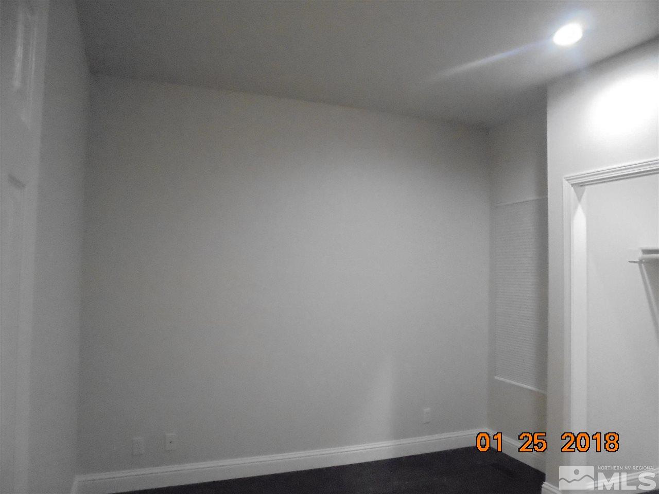 3635 Skyline Boulevard Reno, NV 89509 - Photo 3 of 37 a room with a bench and wooden floor