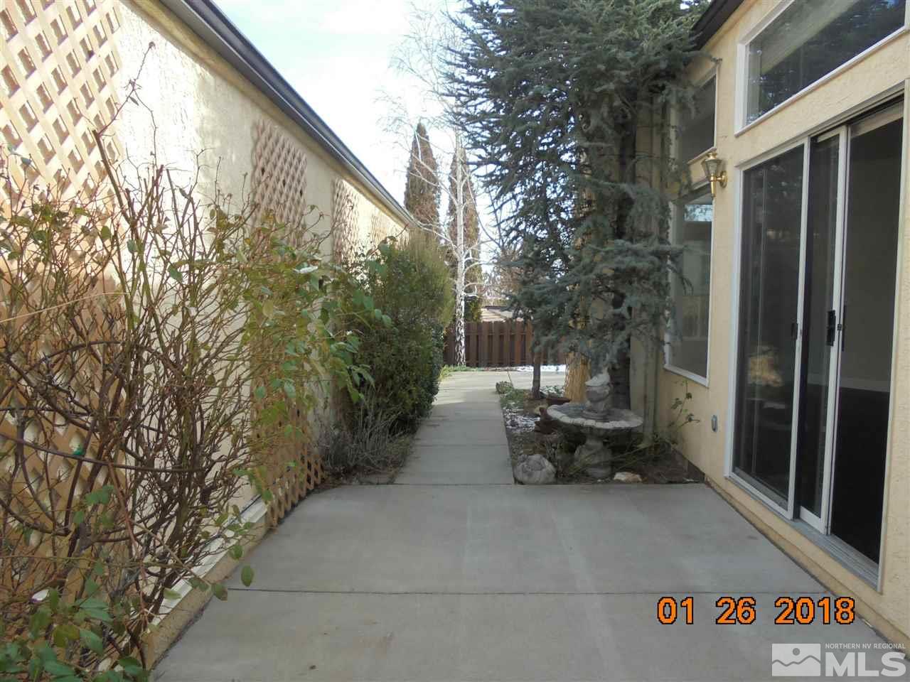 3635 Skyline Boulevard Reno, NV 89509 - Photo 35 of 37 a view of backyard with a table and chairs and potted plants