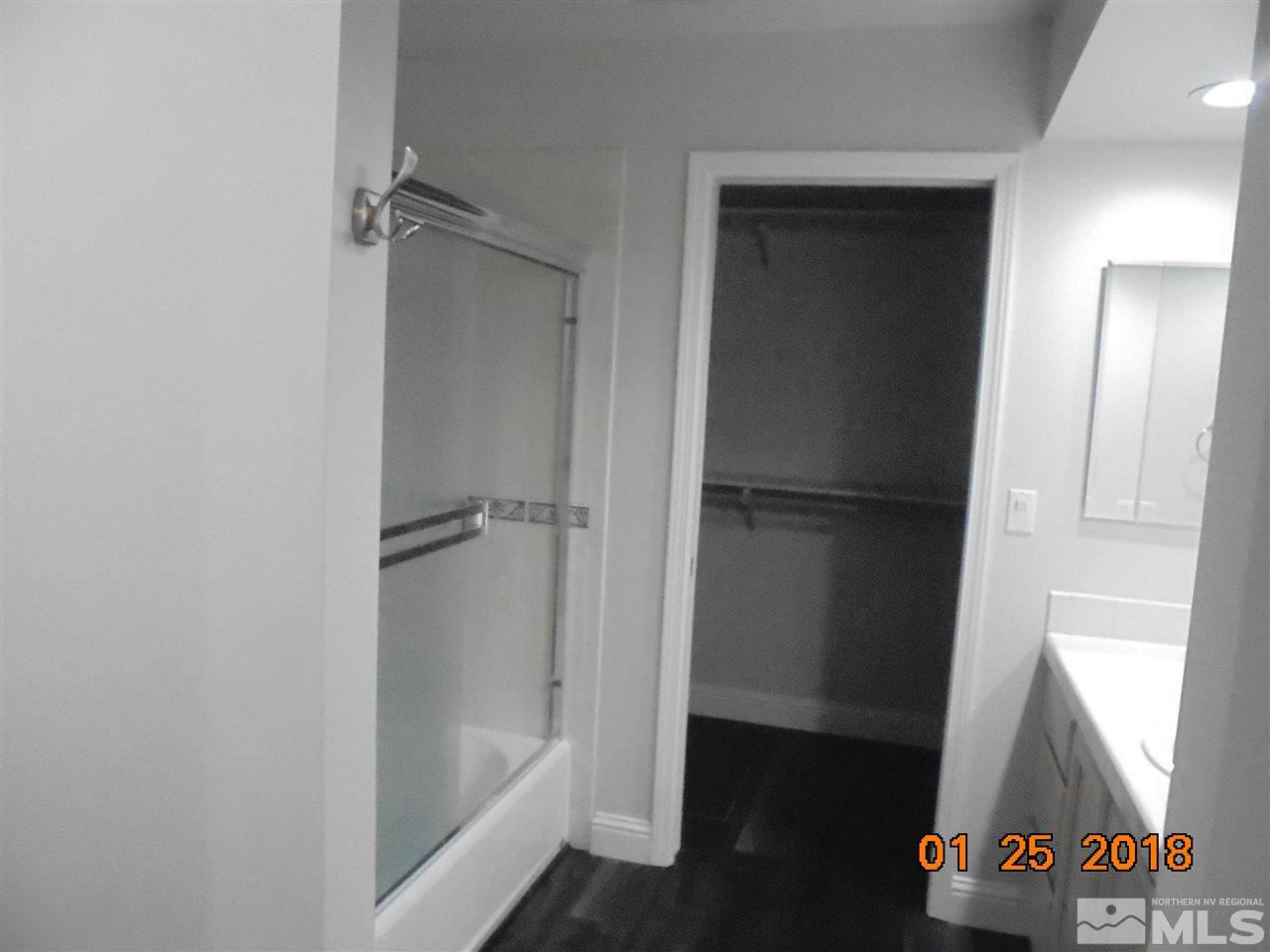 3635 Skyline Boulevard Reno, NV 89509 - Photo 9 of 37 a bathroom with a tub and shower