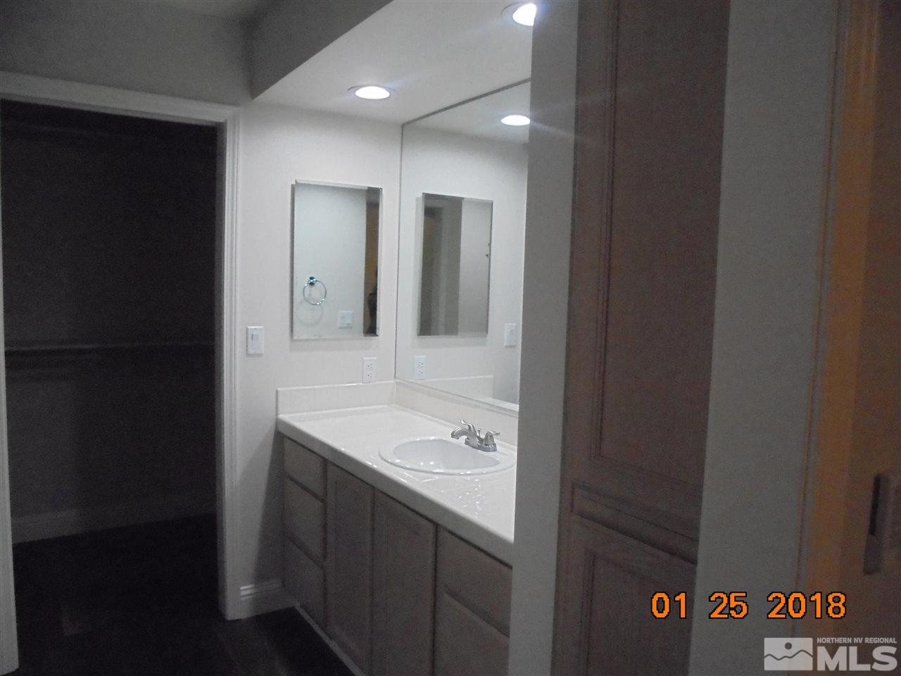 3635 Skyline Boulevard Reno, NV 89509 - Photo 10 of 37 a bathroom with a sink and a mirror