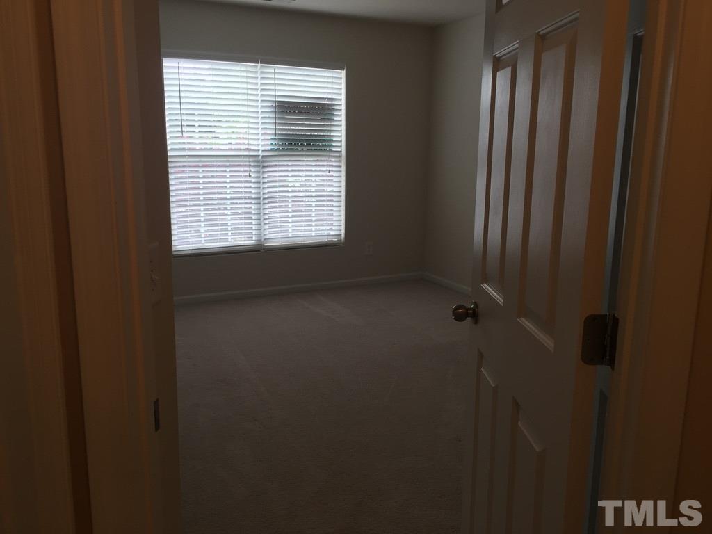 7137 Racine Way Raleigh, NC 27615 - Photo 13 of 13 a view of a bathroom with a window