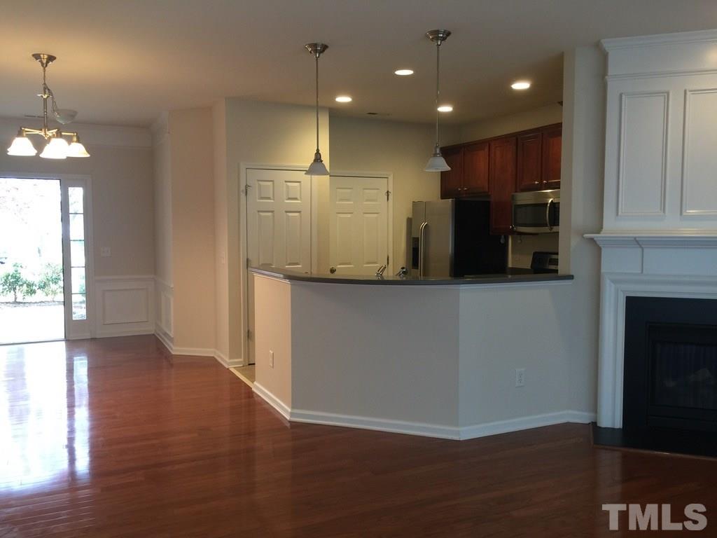 7137 Racine Way Raleigh, NC 27615 - Photo 6 of 13 a view of a kitchen with a sink and a refrigerator