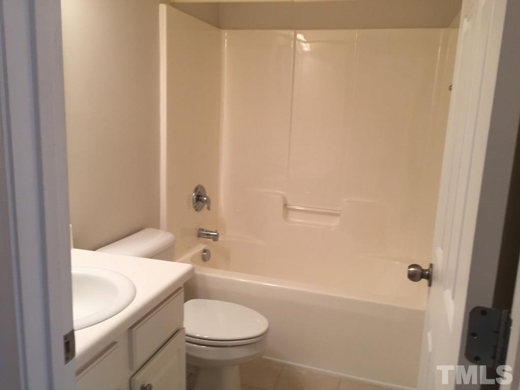 7137 Racine Way Raleigh, NC 27615 - Photo 10 of 13 a bathroom with a sink and a toilet