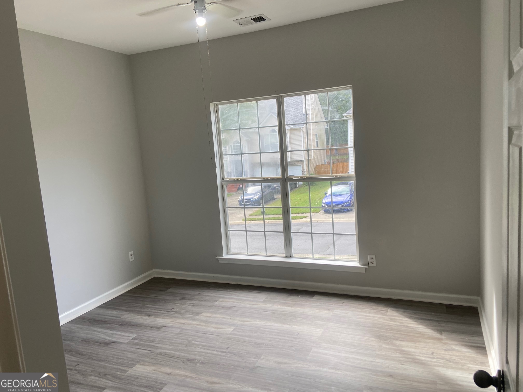 3536 Perry Pointe Austell, GA 30106 - Photo 21 of 32 an empty room with wooden floor and windows