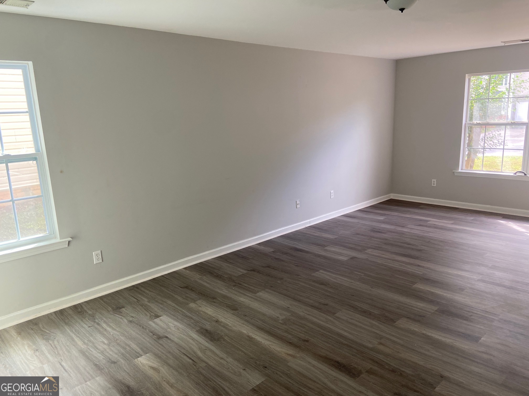 3536 Perry Pointe Austell, GA 30106 - Photo 29 of 32 an empty room with wooden floor and windows