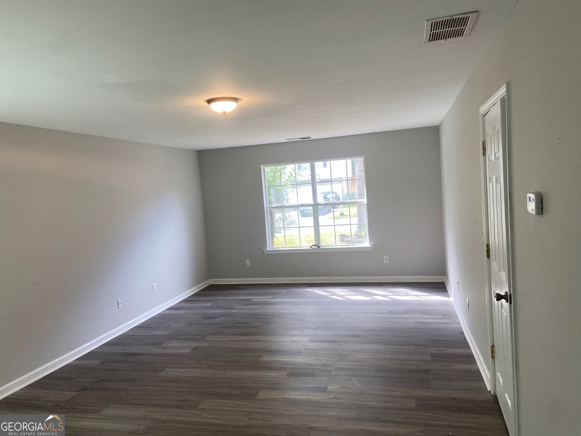 3536 Perry Pointe Austell, GA 30106 - Photo 31 of 32 wooden floor in an empty room with wooden floor and a window
