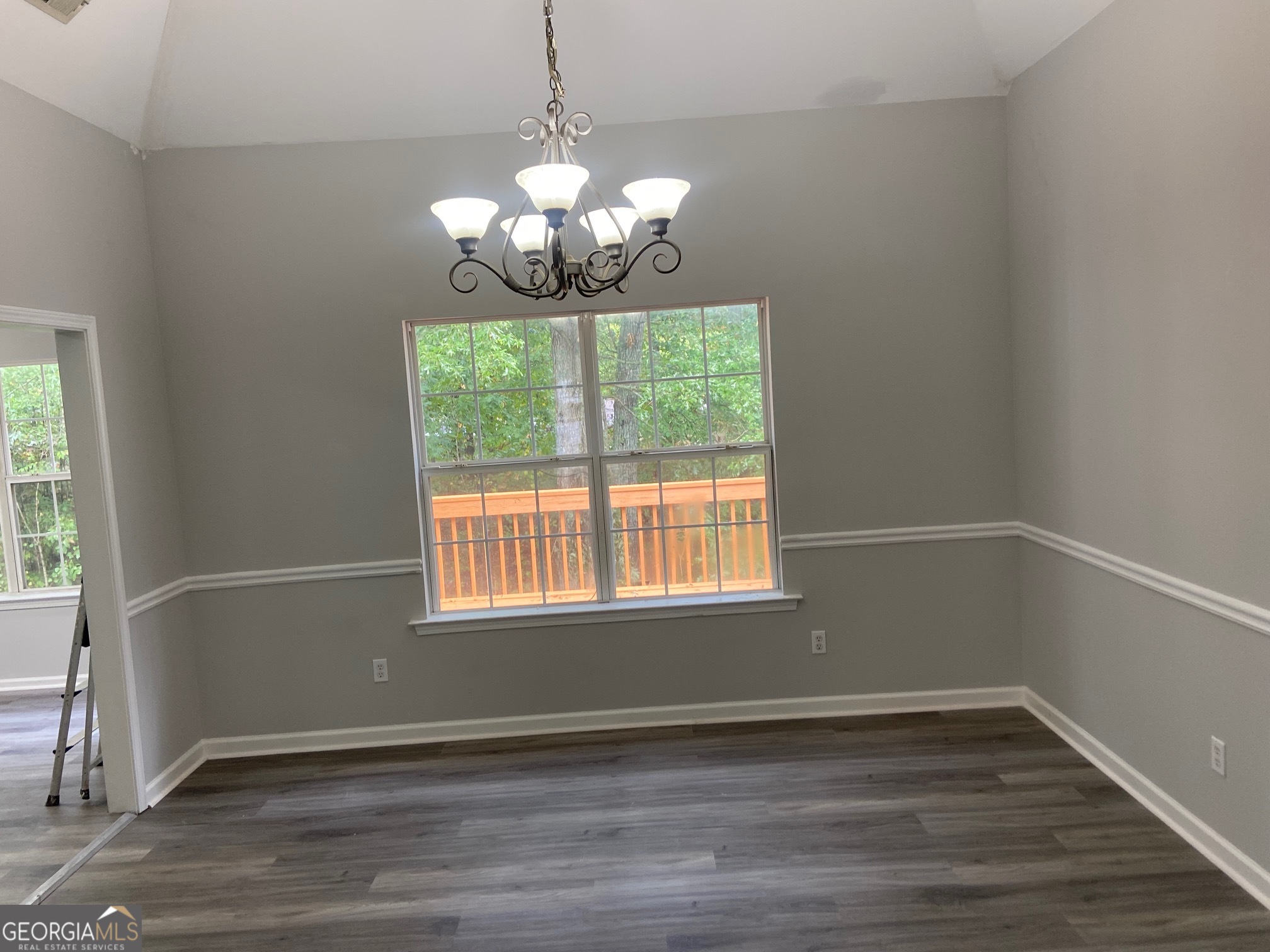 3536 Perry Pointe Austell, GA 30106 - Photo 5 of 32 a view of an empty room with wooden floor and a window