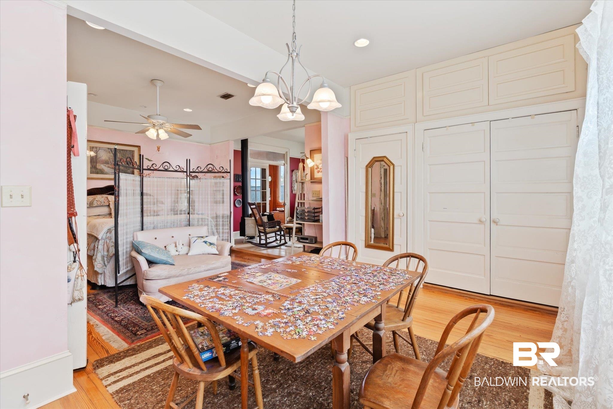 12 Lebaron Street Mobile, AL 36602 - Photo 17 of 37 Dining room with light wood-type flooring and ceiling fan with notable chandelier