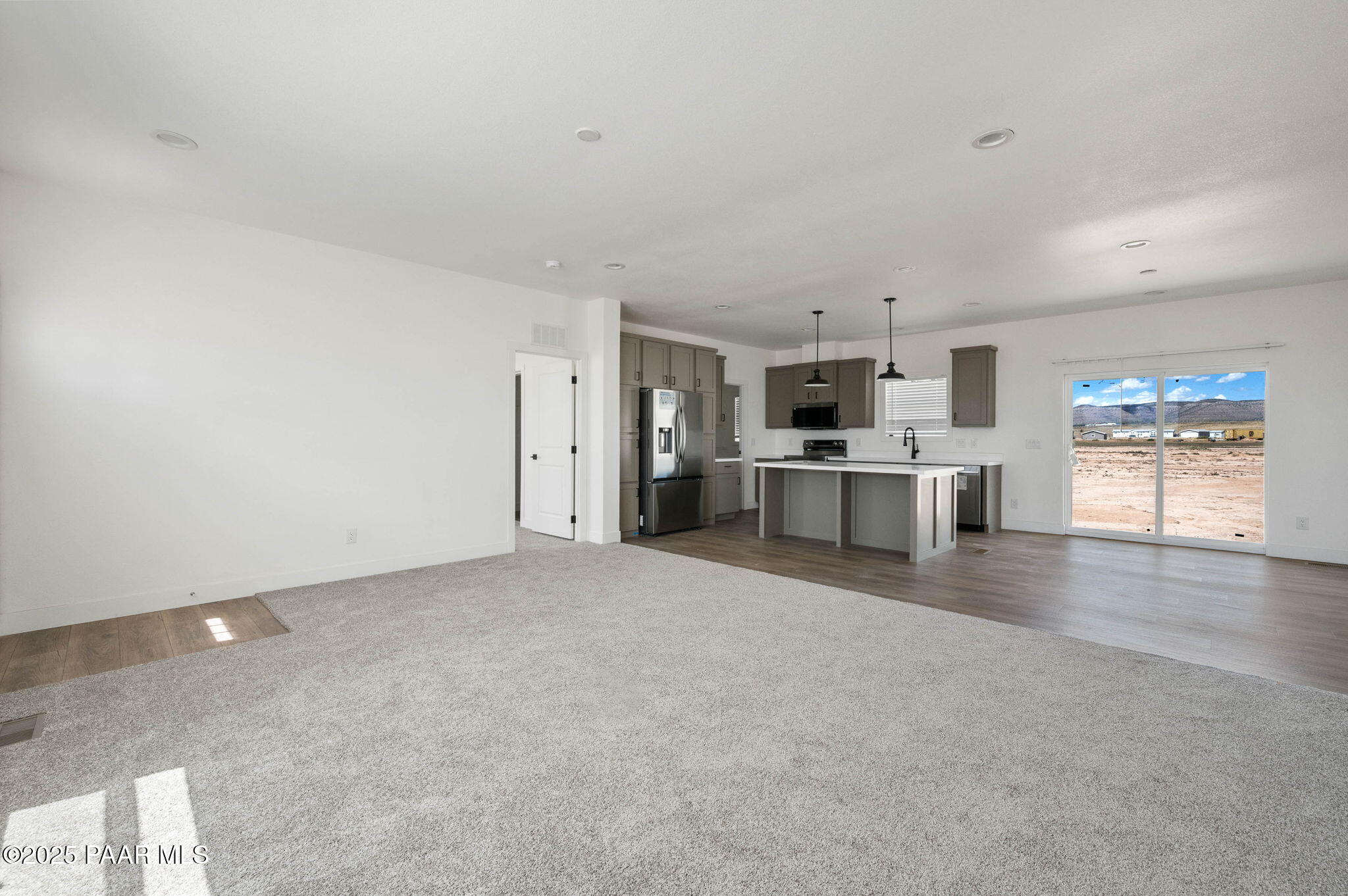 2688 West Altimeter Way Paulden, AZ 86334 - Photo 2 of 22 a view of a kitchen with a sink cabinets and a window