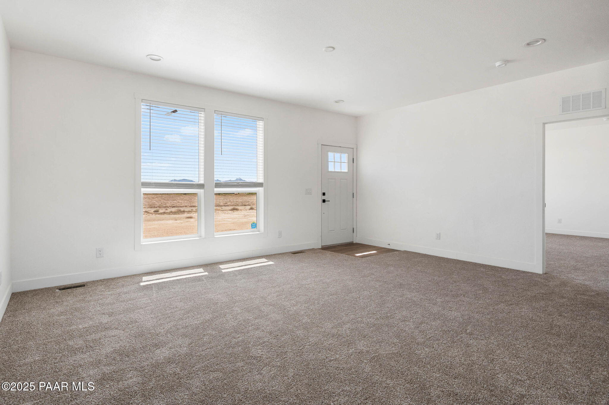 2688 West Altimeter Way Paulden, AZ 86334 - Photo 3 of 22 a view of an empty room with a window