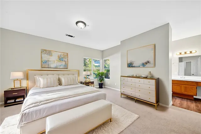 a bedroom with a bed and a dresser