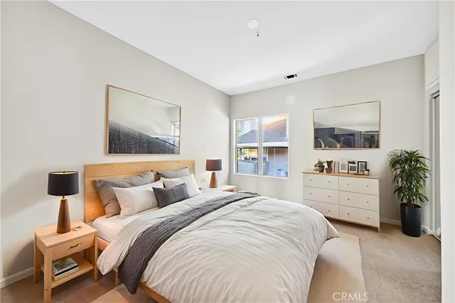 a bedroom with a bed and a couch