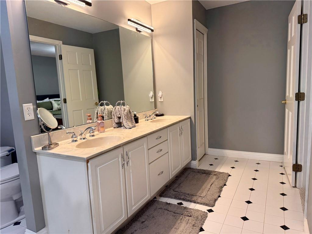 293 Sandy Hill Road Valencia, PA 16059 - Photo 37 of 50 a bathroom with a sink double vanity and a mirror