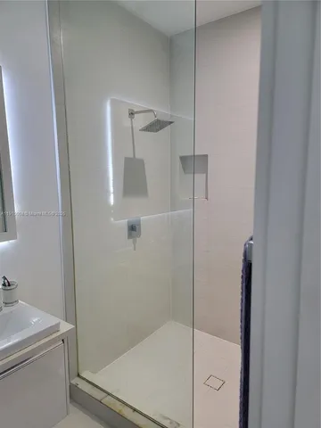a bathroom with a shower and toilet