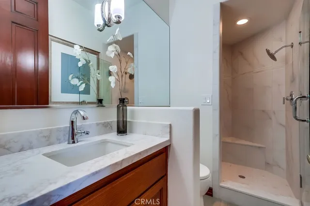 a living room with furniture fireplace and a large window