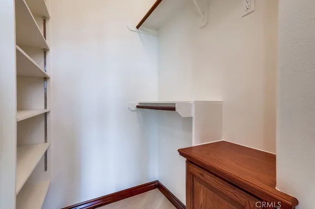 a dining room with furniture a chandelier and wooden floor
