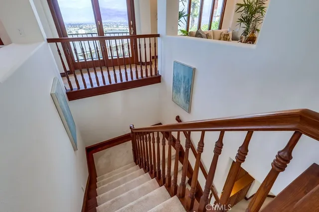 a view of an entryway with wooden floor and a livingroom view