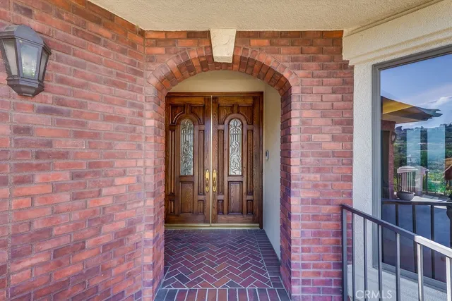 a front view of a brick house with a door