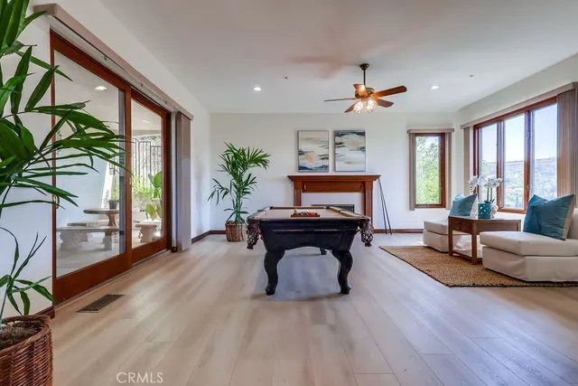 a spacious bathroom with a tub sink and mirror