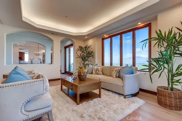 a view of an empty room with cabinet and a window
