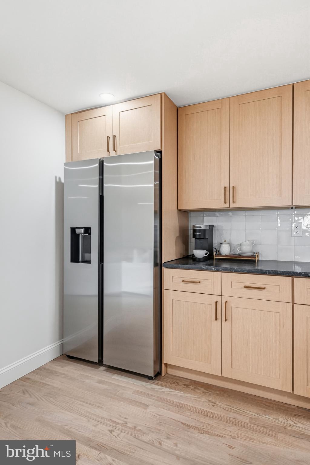 1309 Marlkress Road Cherry Hill, NJ 08003 - Photo 23 of 57 a kitchen with stainless steel appliances granite countertop a refrigerator a stove a sink and white cabinets with wooden floor