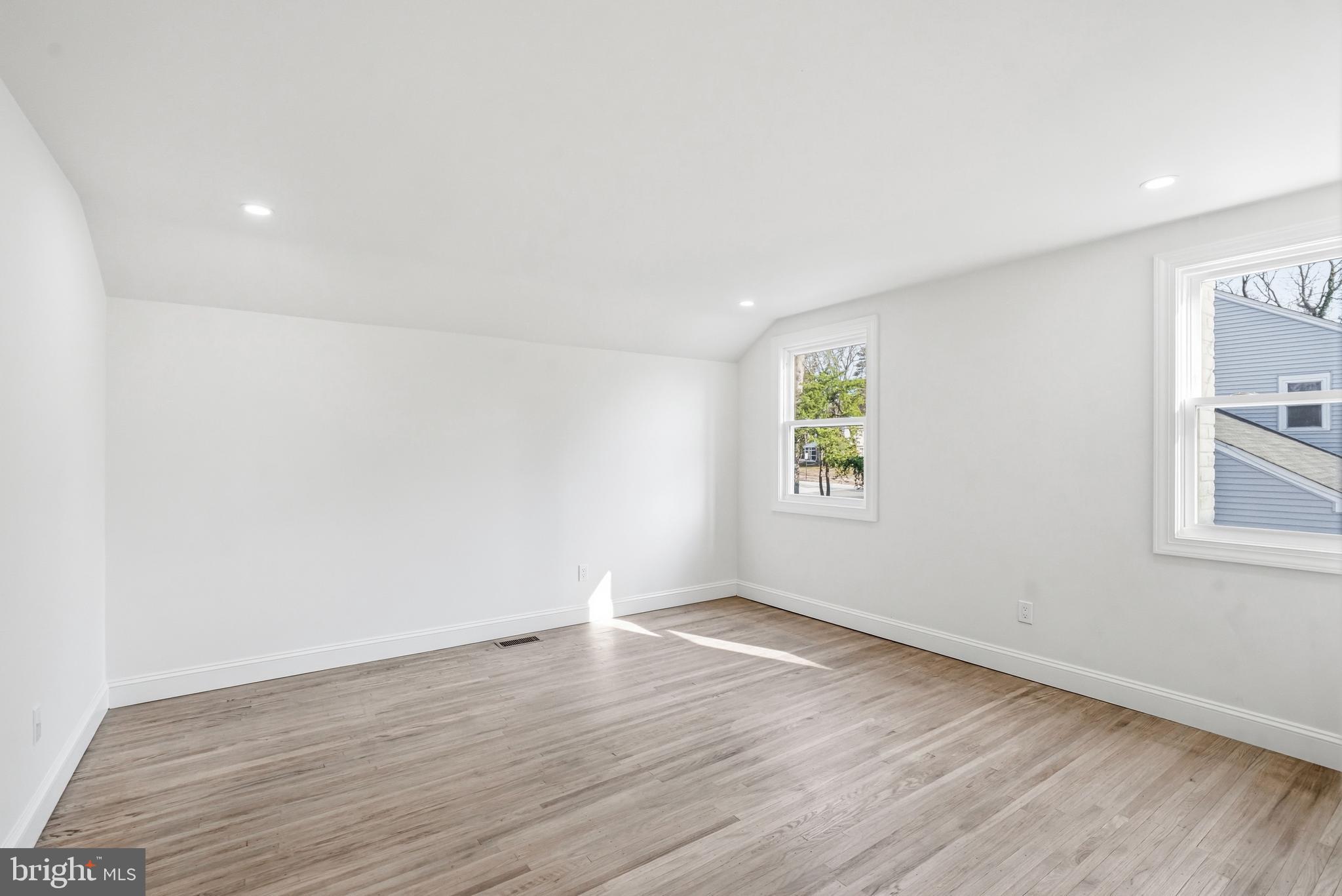 1309 Marlkress Road Cherry Hill, NJ 08003 - Photo 31 of 57 an empty room with wooden floor and windows