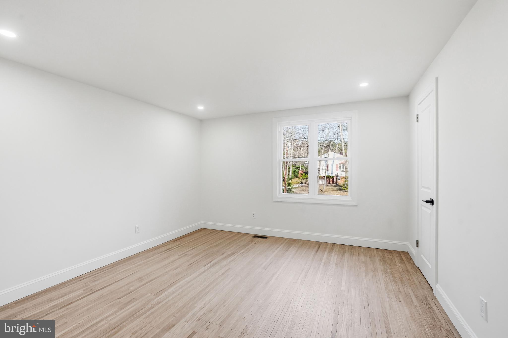 1309 Marlkress Road Cherry Hill, NJ 08003 - Photo 32 of 57 wooden floor in an empty room with a window