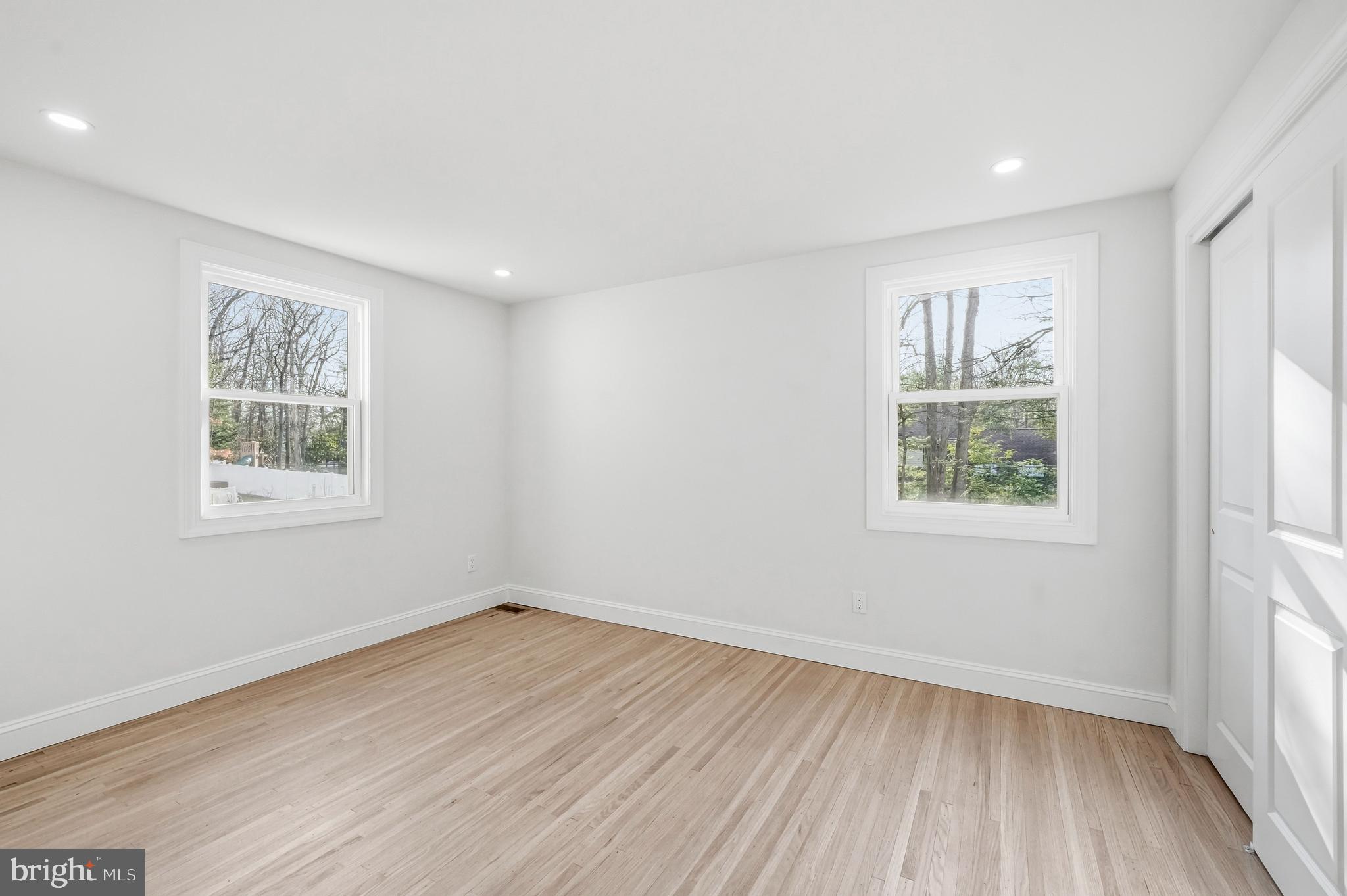 1309 Marlkress Road Cherry Hill, NJ 08003 - Photo 33 of 57 wooden floor in an empty room with a window