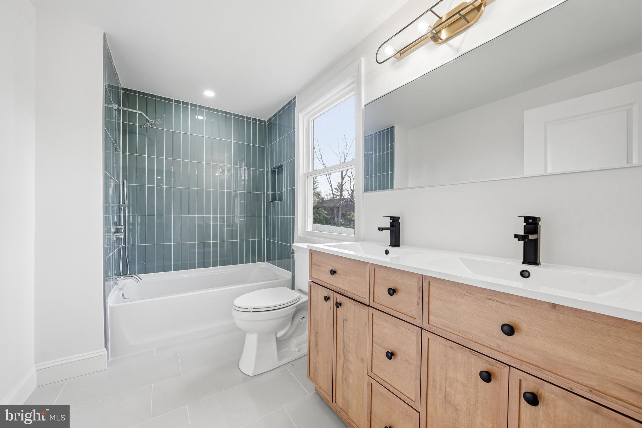 1309 Marlkress Road Cherry Hill, NJ 08003 - Photo 34 of 57 a bathroom with a sink a toilet and shower