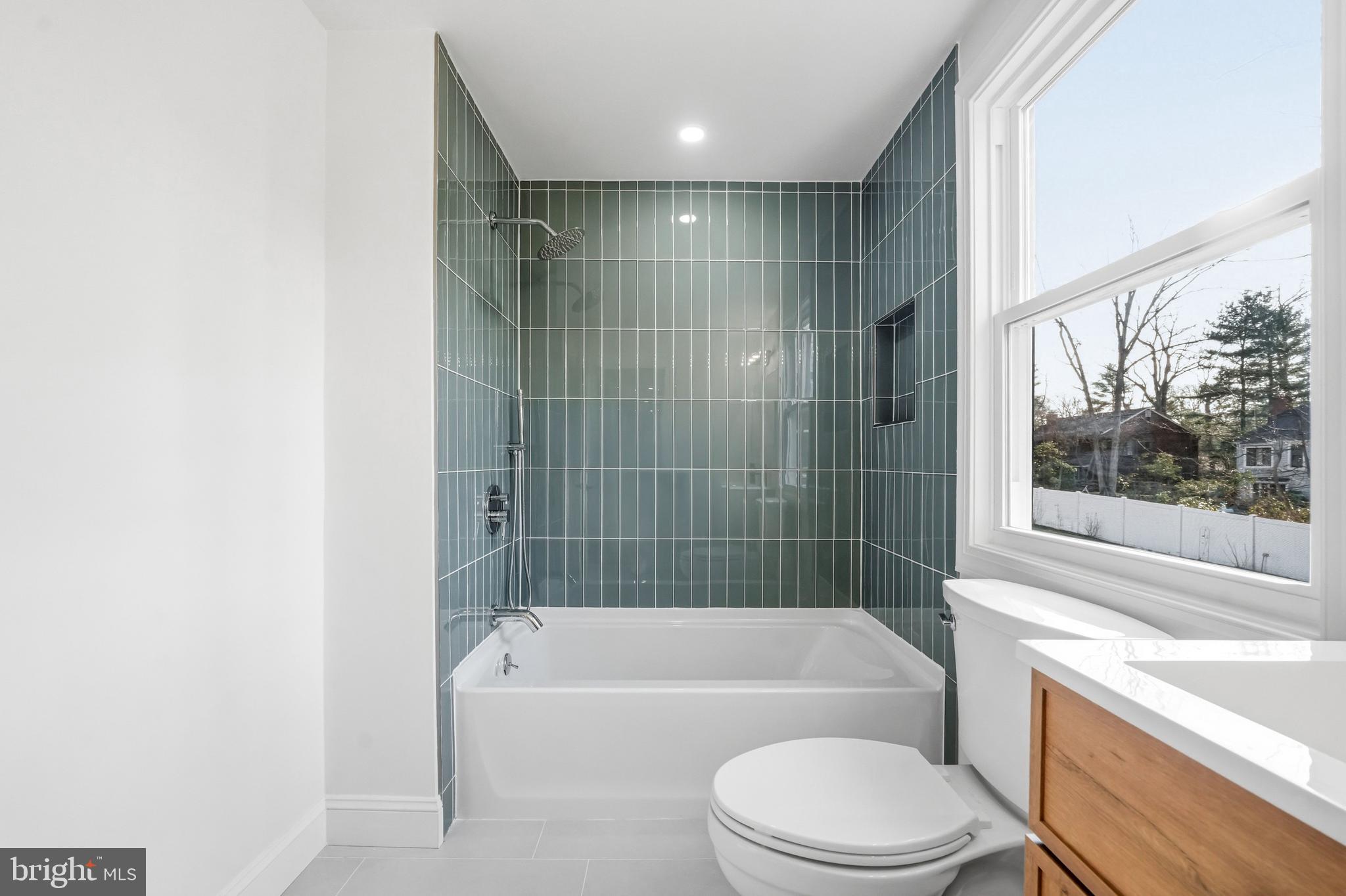 1309 Marlkress Road Cherry Hill, NJ 08003 - Photo 35 of 57 a bathroom with a bathtub shower sink vanity and toilet