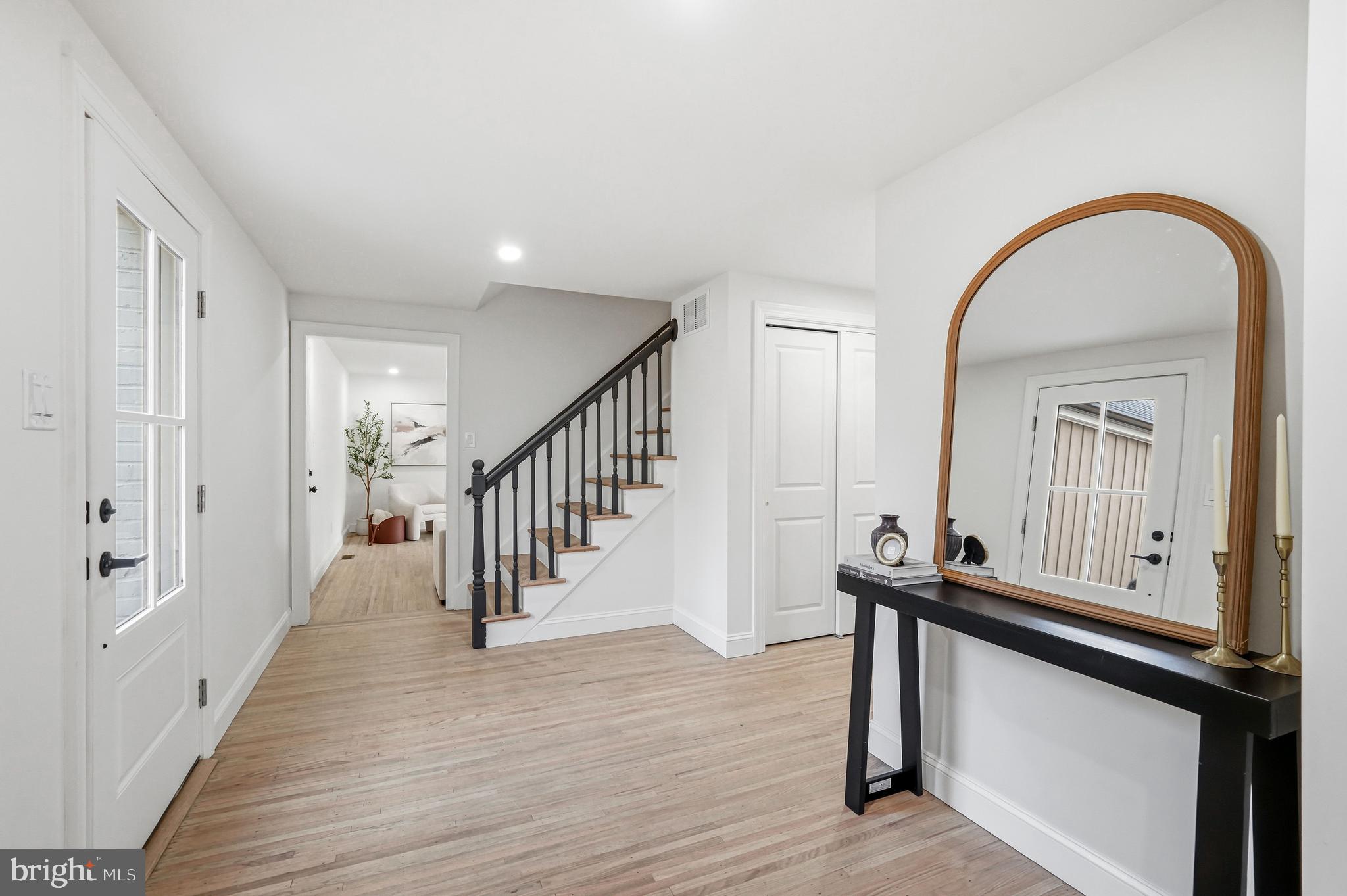 1309 Marlkress Road Cherry Hill, NJ 08003 - Photo 5 of 57 a view of an entryway with wooden floor and stairs