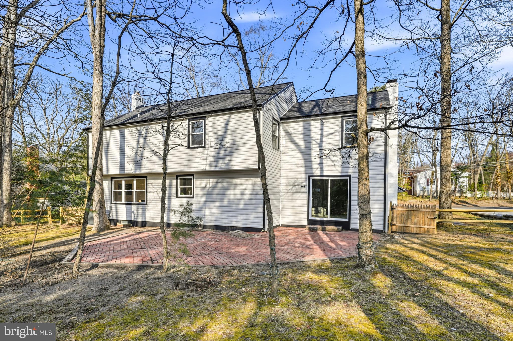 1309 Marlkress Road Cherry Hill, NJ 08003 - Photo 52 of 57 a view of a house with large windows and a small yard