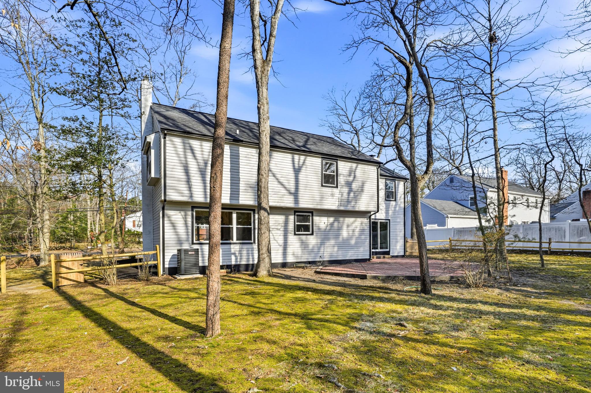 1309 Marlkress Road Cherry Hill, NJ 08003 - Photo 54 of 57 a view of a swimming pool with a bench and trees