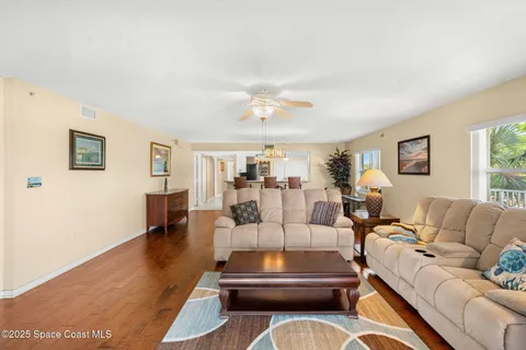 a living room with furniture and a table