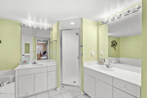 a bathroom with a sink double vanity and a mirror