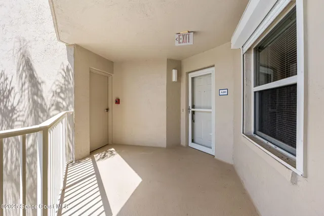 a view of a hallway with a bedroom