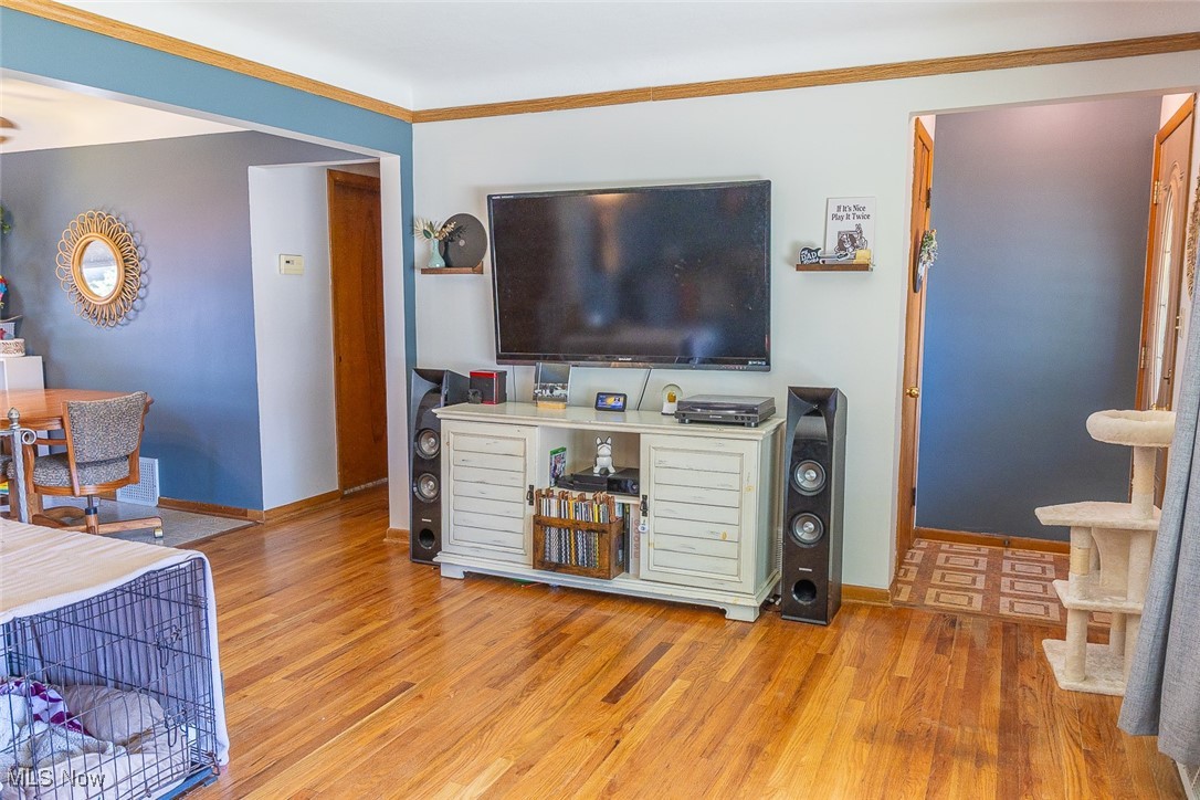 797 Glenhurst Road Willowick, OH 44095 - Photo 3 of 28 Living room with wood finished floors and ornamental molding
