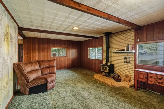 a living room with furniture window and a table