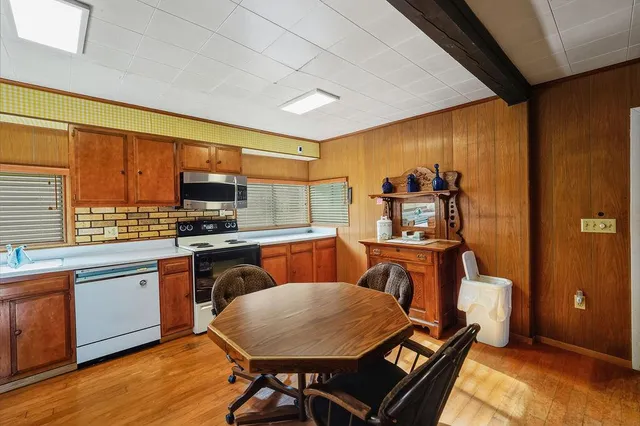 a view of a kitchen with a sink and cabinets