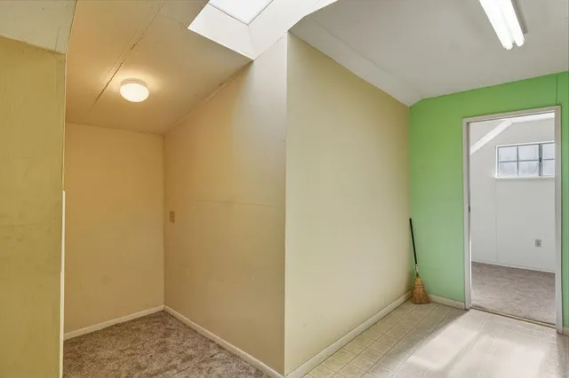 a view of an entryway with a hallway